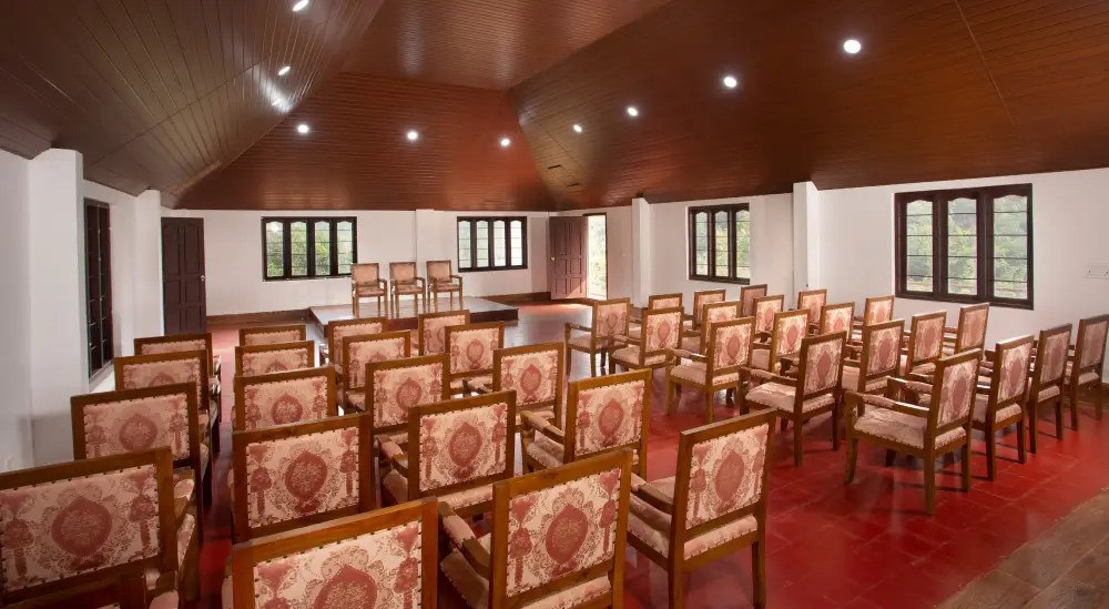 “Elegant banquet hall at Heaven Inn Munnar designed for corporate meetings, conferences, and private events with modern facilities and scenic views.”