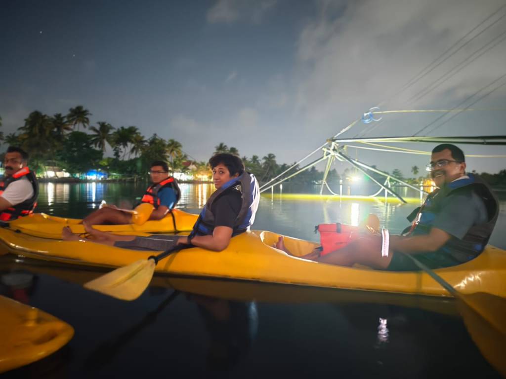 Group enjoying a peaceful kayaking experience with Ben’s Cruise in Kerala