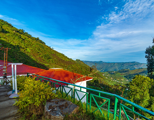 “Beautiful hill landscape with lush greenery and misty peaks.”