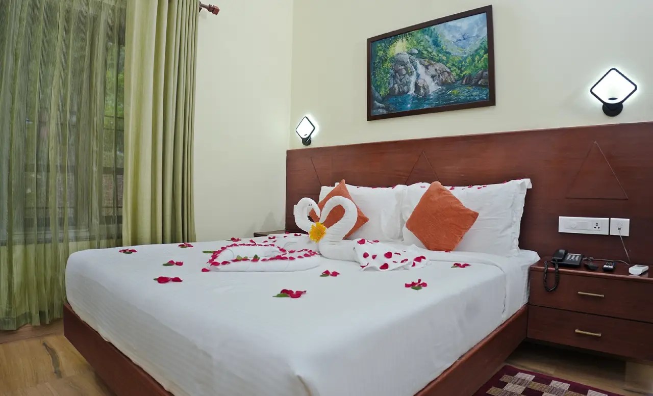 Elegant resort bedroom at Indeevara with contemporary design and serene atmosphere.