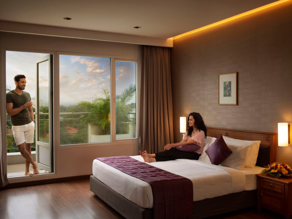 Elegant rooms at Monsoon Empress in Kochi featuring modern interiors, comfortable bedding, and premium amenities for a luxury stay experience.