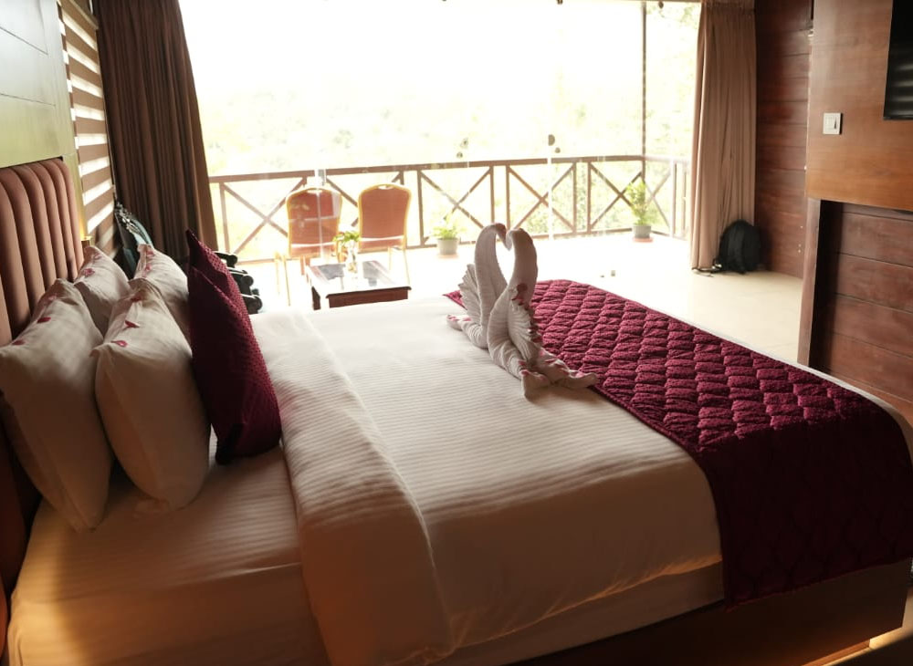Mountain Pool Villa at Southern Panorama Indriya Munnar featuring a private swimming pool, spacious luxury bedroom, and panoramic views of misty mountains and lush tea plantations.